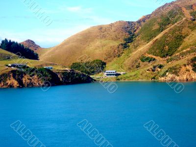 House On Edge Of Lake 