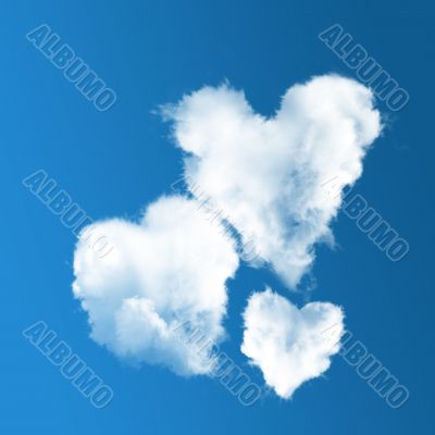 three heart-shaped clouds on blue sky 