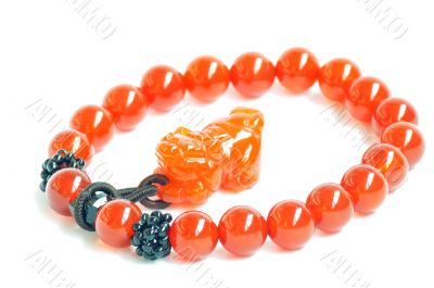 Red jade prayer beads on a white background
