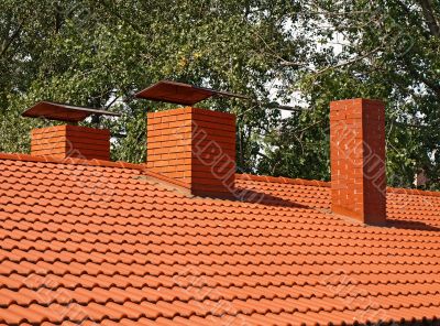 The roof is covered with orange tiles 