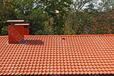 The roof is covered with red tiles   
