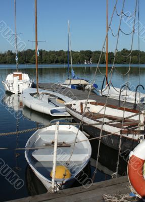 Boats by a  pier
