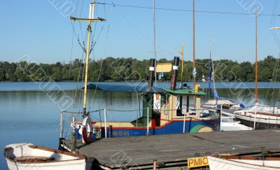 Boats by a  pier