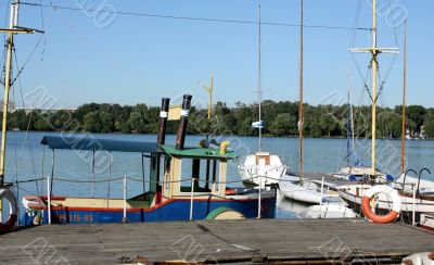 Boats by a  pier