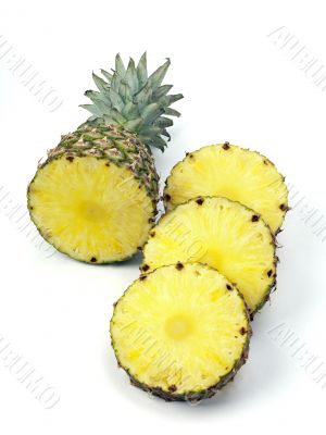 pineapple top and slices on white
