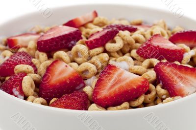 healthy cereal rings with sliced strawberries