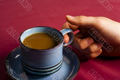 holding coffee