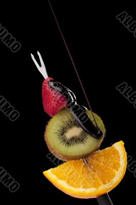 fruits on the stick with chocolates