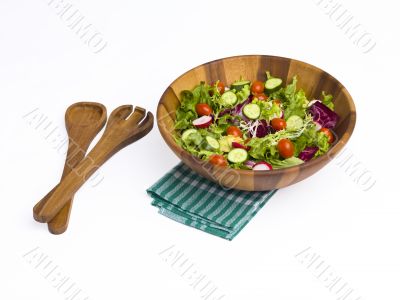 green salad with tongs
