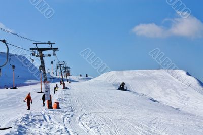 skiers on the lift