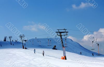 skiers on the lift