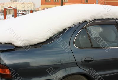 Snow on the roof of the car