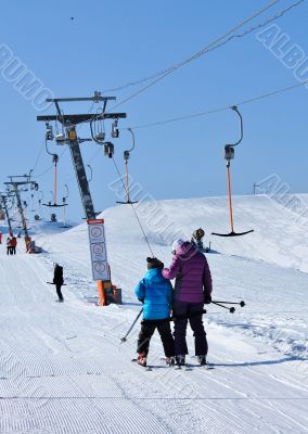 skiers on the lift