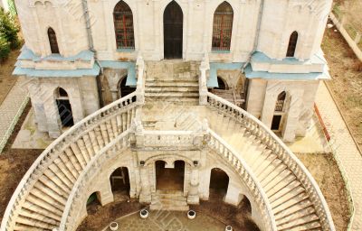 White stone church built in russian gothic style, view from abov