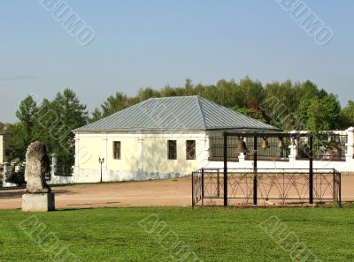 Church bells and stone statue