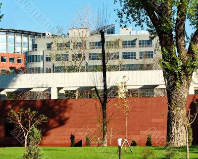 Buildings behind the red fence
