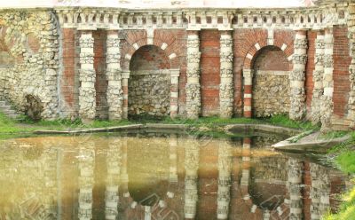 Grotto on the pond&rsquo;s shore