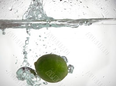 lime falling in clear water