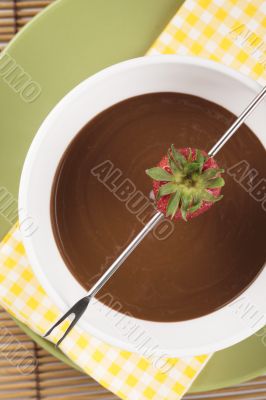 top view image of a strawberry on fondue stick 