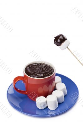white marshmallow  dipped on melted chocolate