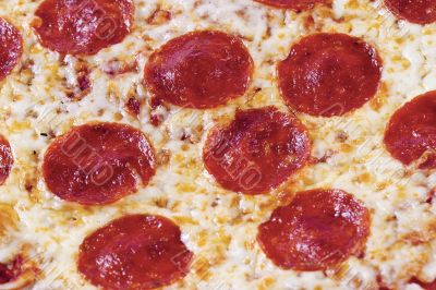 extreme close up of pepperoni pizza