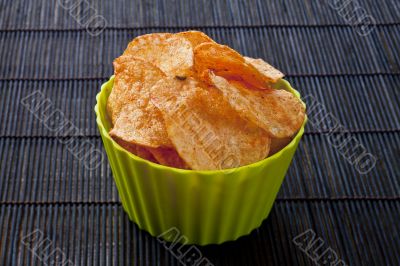 cheese flavored potato chips in green bowl