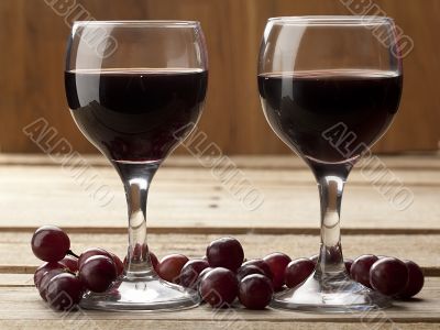 close up shot of red wine and grapes