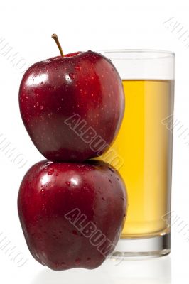 stack of apples and juice glass