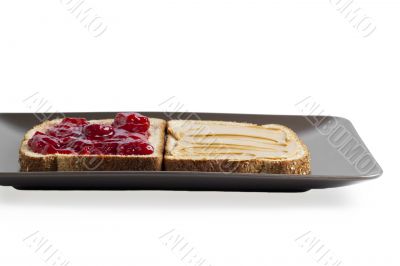 honey and strawberry jam in a toast