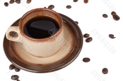 coffee cup and scattered beans