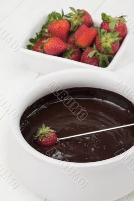 strawberries and chocolate syrup