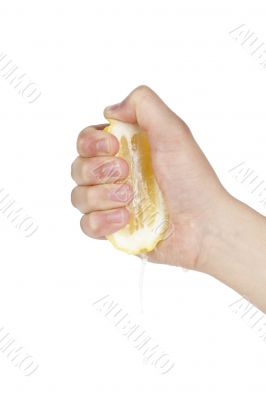 hand squeezing lemon