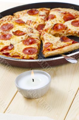 pizza on pan with spatula