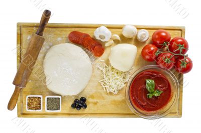 ingredients for homemade pizza on wooden board