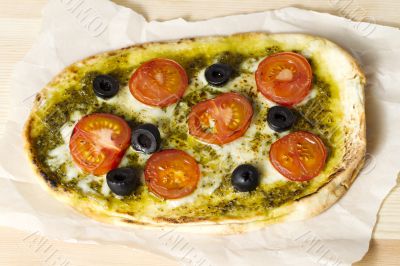 pizza with tomatoes and olives