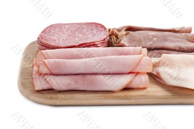 ham in wooden plate