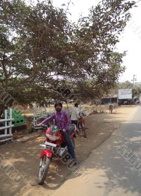 Indian man on a motorcycle