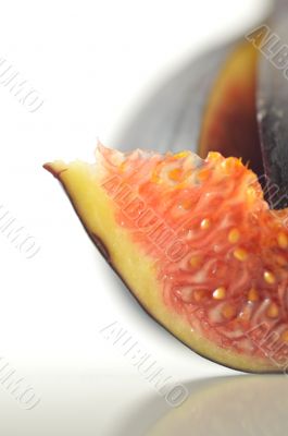 slices of fig on a white background