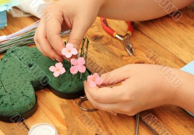 Women`s hands with needlework