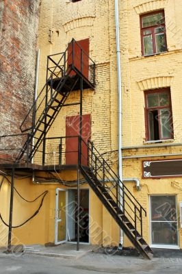 Metal ladder at the wall of the house