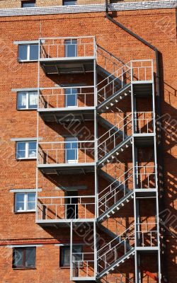 Metal ladder at the wall of the house