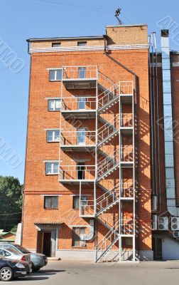 Metal ladder at the wall of the house