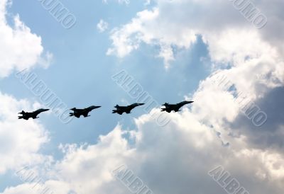 Aerobatic  group on the background of white clouds