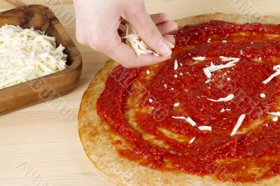 grated cheese in a wooden bowl