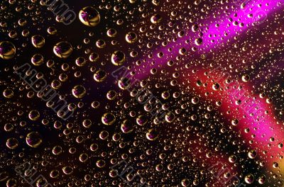 Water drops over colored background