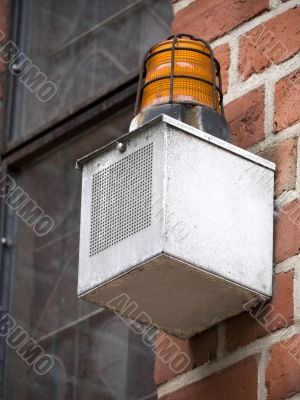 Alarm-brick wall-orange
