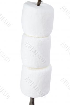 three marshmallows in a stick 