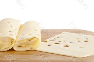 slices of cheese on wooden plate