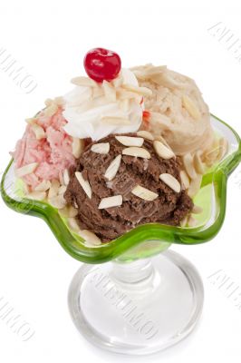 three scoops of ice cream with cherry toppings