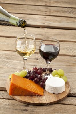 view of cheese with grapes and wine